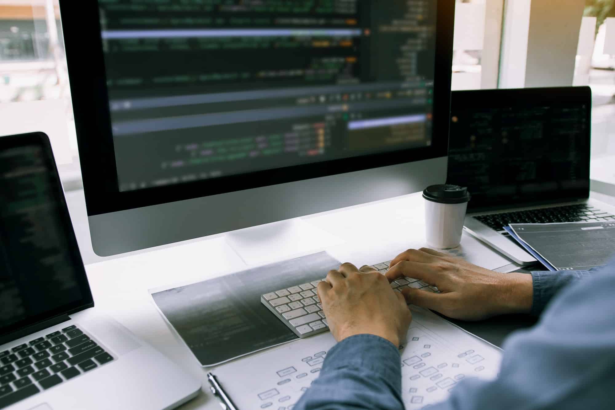 Asian man working code program developer computer web development Asian man working code program developer computer web development